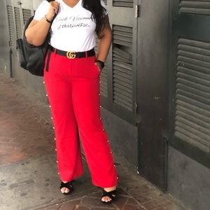 Red pants with gold button detail
